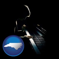north-carolina map icon and a concert pianist playing a piano